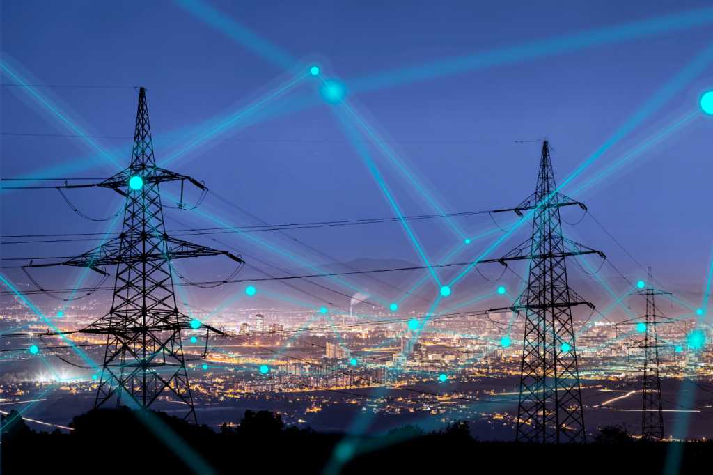 High power electricity poles in urban area connected to smart grid. Energy supply, distribution of energy, transmitting energy, energy transmission, high voltage supply concept photo.