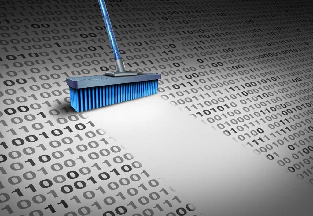 Deleting data technology concept as a broom wiping clean binary code as an internet security