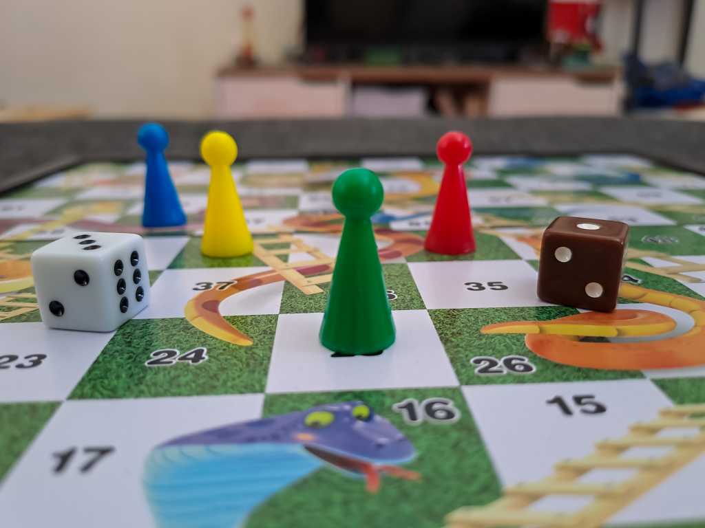 A close-up view of the Snakes and Ladders board game.