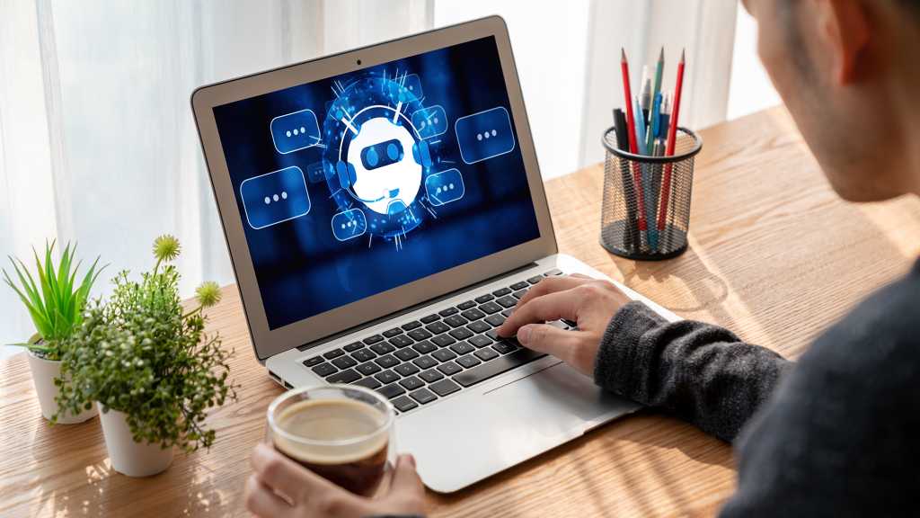 user at laptop with genai chatbot assistant